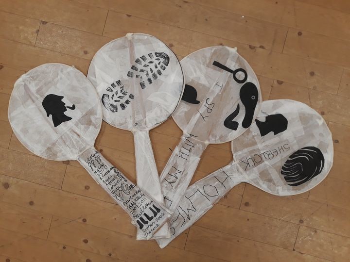 Four finished willow and paper mache magnifying glasses with Sherlock Holmes iconography